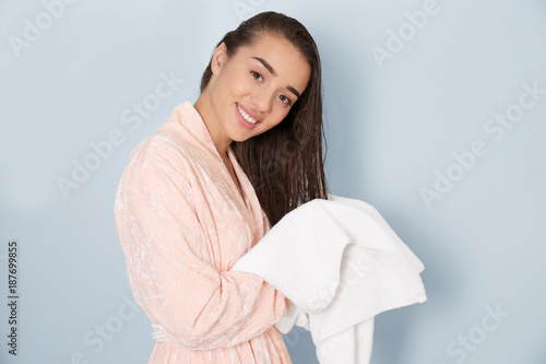 Young woman drying her hair...
