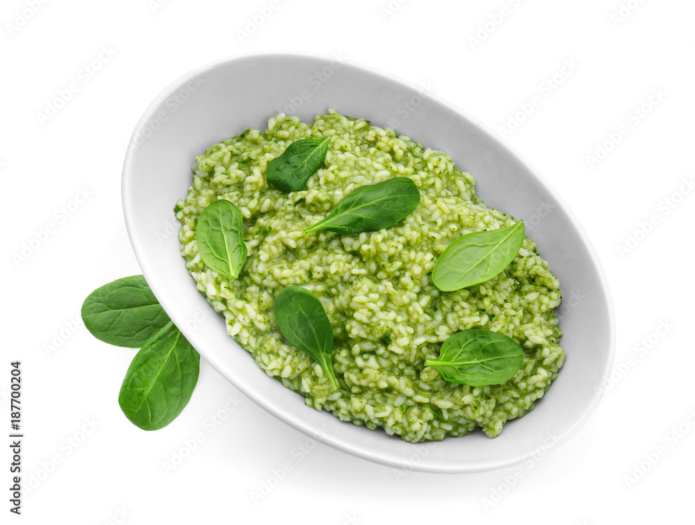 Dish with tasty spinach risotto on white background Dish with tasty spinach risotto on white background