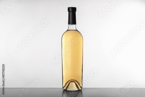 Bottle with wine on white background © Africa Studio