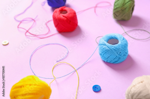 Set of crocheting clews on color background