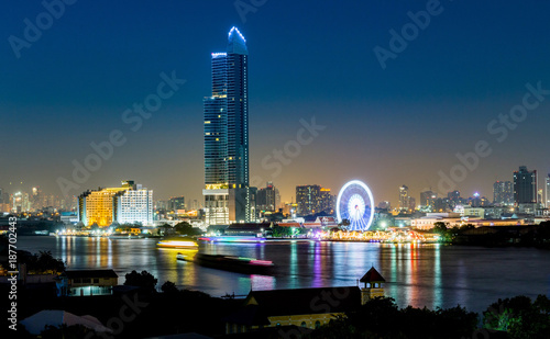 Bangkok, Thailand, 27 dec 2017 - Night architecture Business office building and Ferris Wheel in Bangkok, Asiatique The Riverfront in Bangkok, Chao Phraya River, Thailand