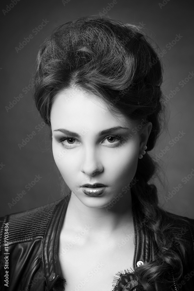 Glamorous portrait of young brunette woman with bright makeup and stylish hair black and white image Glamorous portrait of young brunette woman with bright makeup and stylish hair black and white image