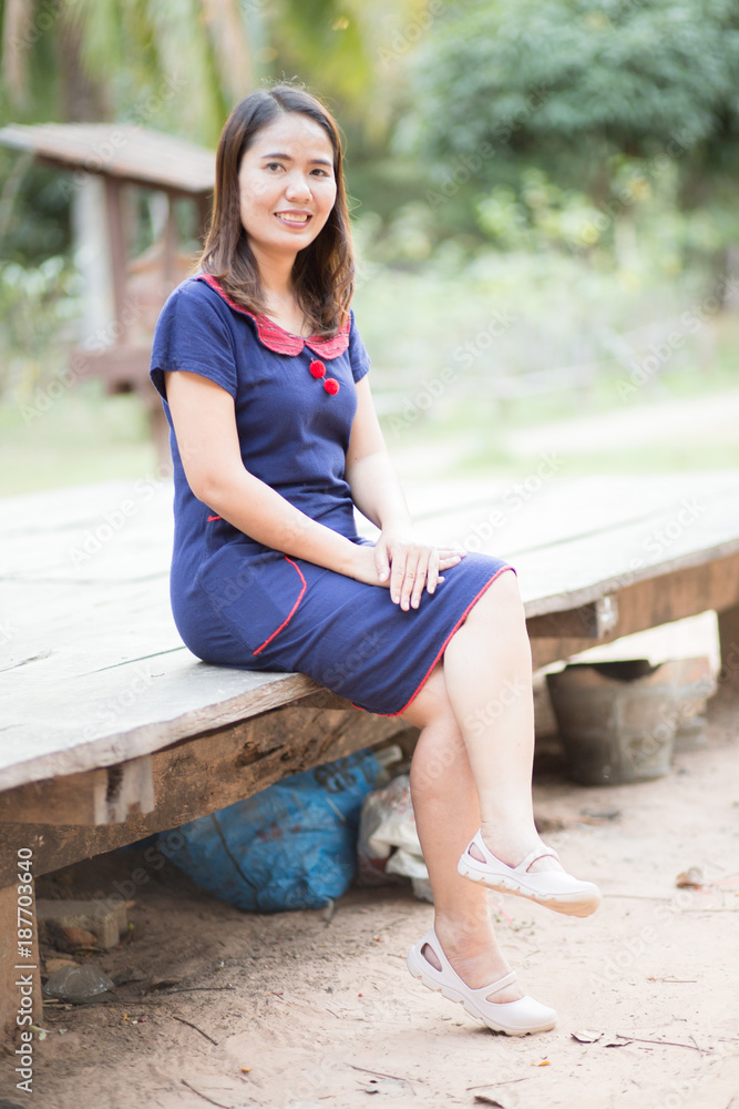 Asian women wear native dress and  live in Thailand.