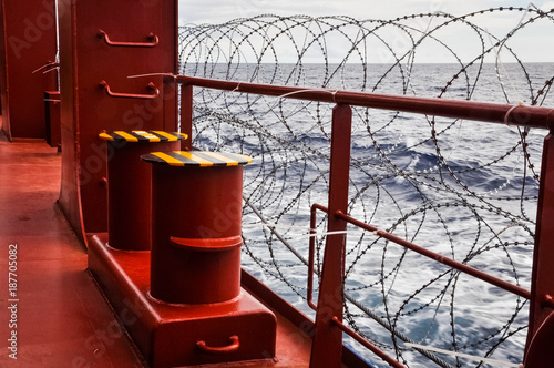 Close up of protection measures on a ship against pirats attacks in danger area photo