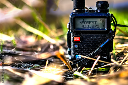 Walkie-talkie in the grass with photo