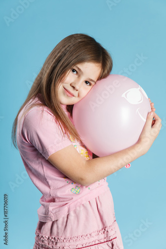 Beautiful little girl with pink ballon