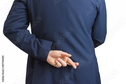 Closeup of a business man with his hand behind his back and fingers crossed.