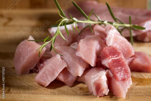 Raw pork ready to Cook on a wooden cutting board