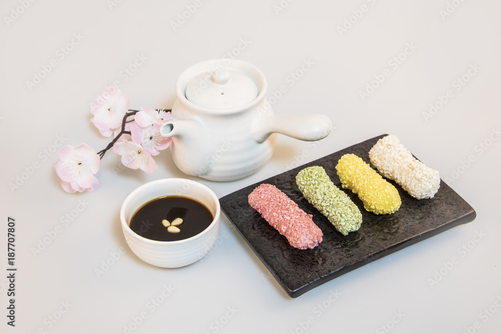 Korea traditional cookies on the dish. teapot. tea. cherry blossom Korea traditional cookies on the dish. teapot. tea. cherry blossom