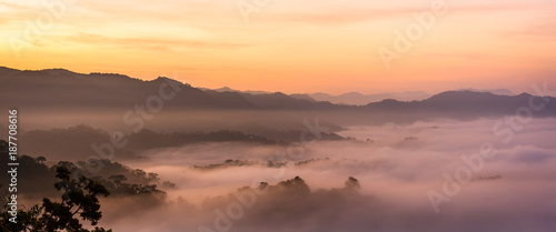 Sunrise and sea of mist at Khao Phanoen Thung, Kaeng Krachan National Park in Thailand photo