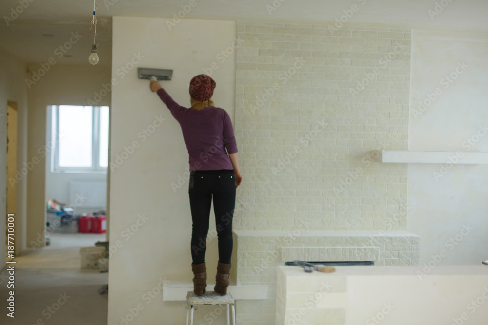 Girl girl doing repairs in room Girl girl doing repairs in room