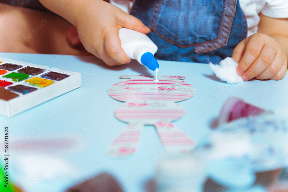 mother with kid making paper bunny mother with kid making paper bunny