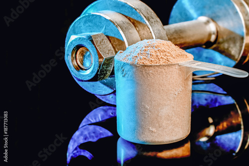 Measuring scoop with whey protein photo