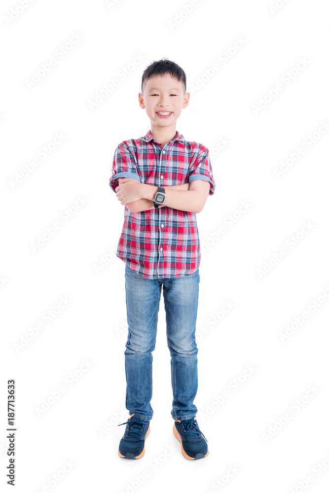 Young asian boy standing and smiling isolated over white background Young asian boy standing and smiling isolated over white background