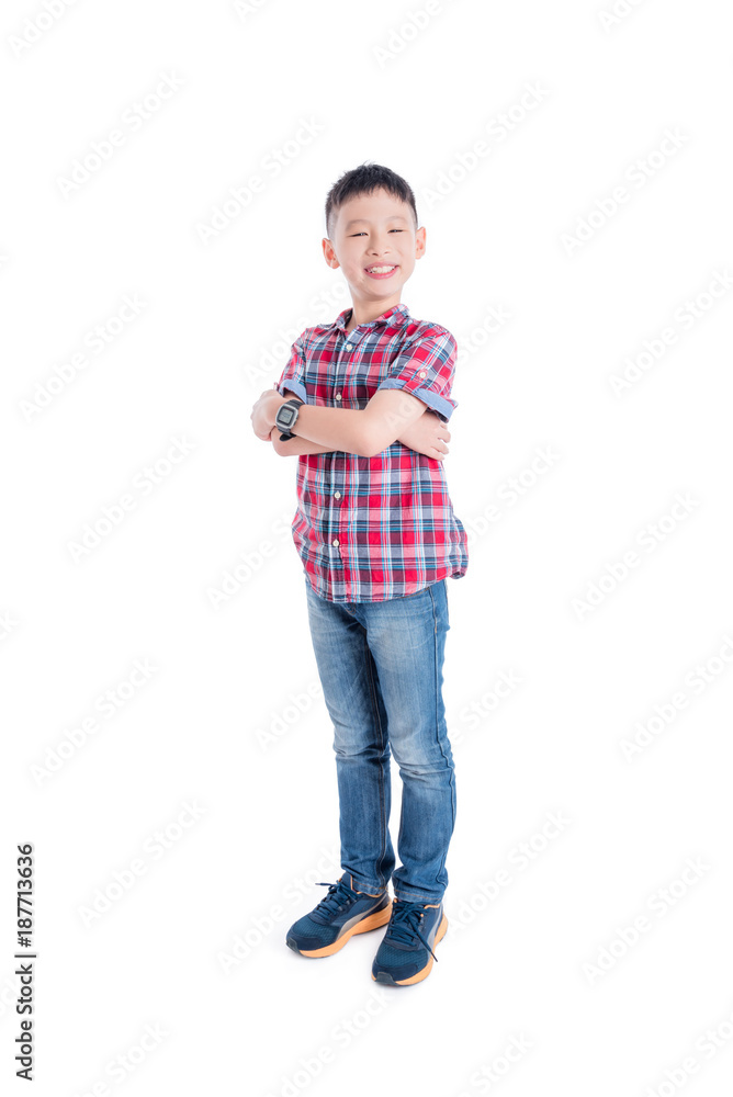 Young asian boy standing and smiling isolated over white background Young asian boy standing and smiling isolated over white background