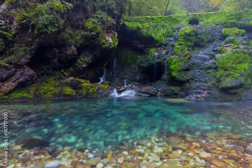 Fototapeta Naklejka Na Ścianę i Meble -  A small waterfall in the forest