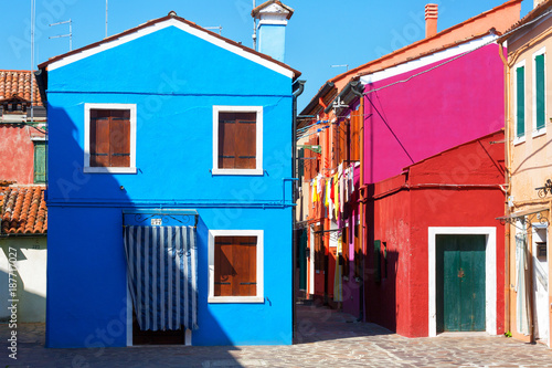 Colourfully painted house facade on Burano island, province of Venice, Italy
