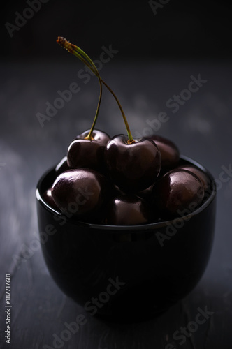 Cherries in black bowl