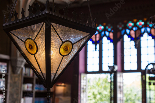 Closeup of Antique Colorful Glass Chandelier in Bookshop photo