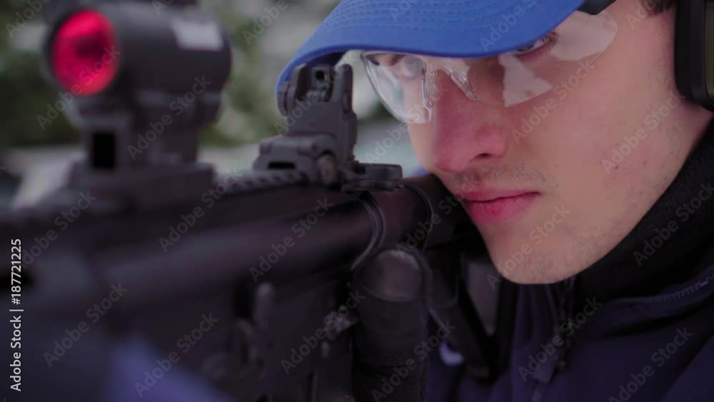 close up of a man aiming gun ready to fire close up of a man aiming gun ready to fire