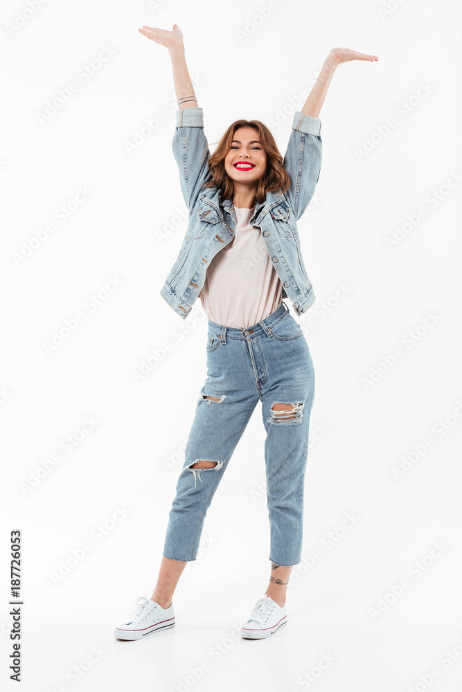 Full length image of Happy woman in denim clothes Full length image of Happy woman in denim clothes