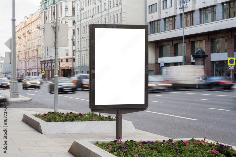 Fototapeta premium Blank mock up of vertical street poster billboard on city background