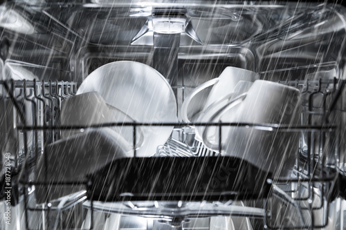 dishwasher machine working process. inside view photo