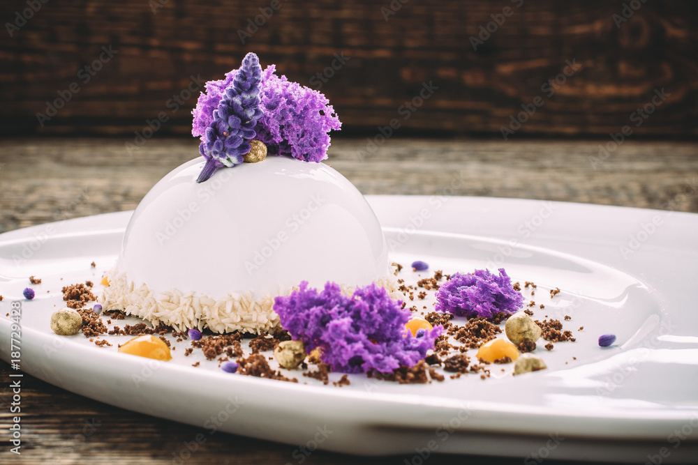 Ice cream with lavender, honey, chocolate and coconut shavings on old wooden table. Side view, Close-up Ice cream with lavender, honey, chocolate and coconut shavings on old wooden table. Side view, Close-up