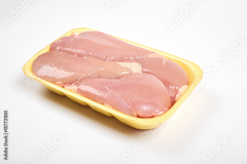 Raw chicken fillet package isolated on white background.
