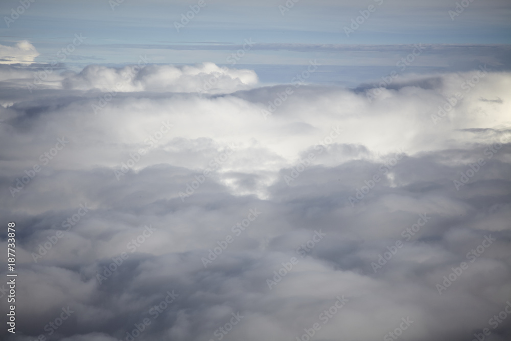 flying high in a blue sky with white clouds and sun shine flying high in a blue sky with white clouds and sun shine