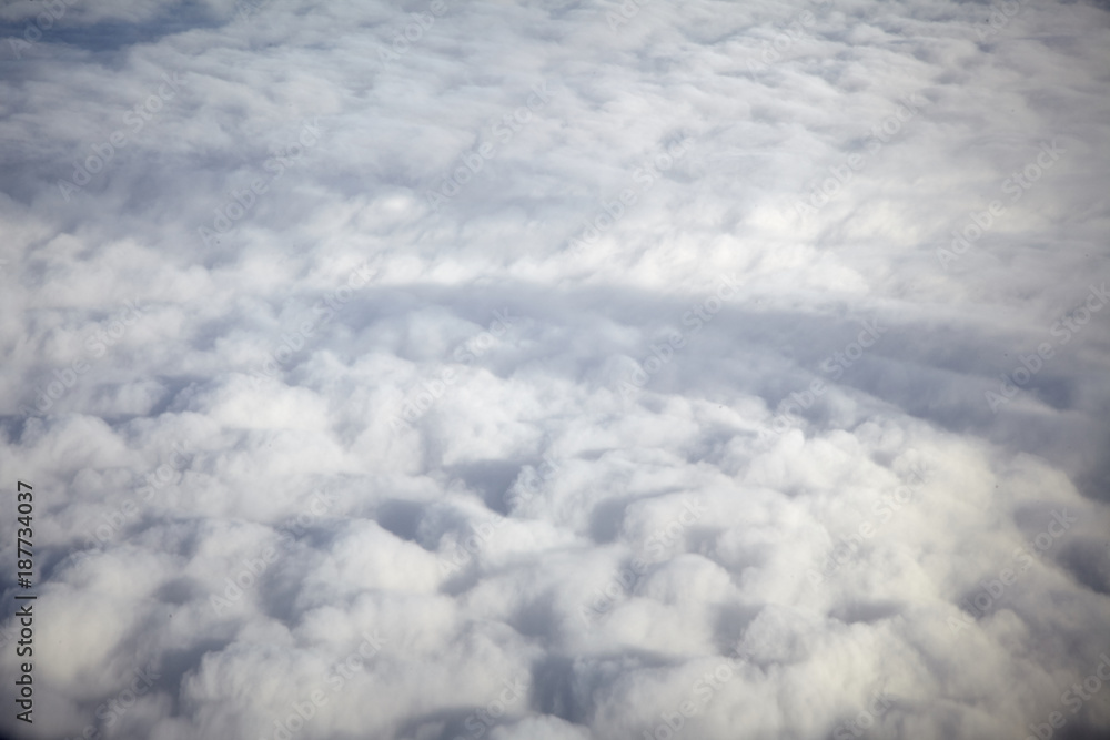 flying high in a blue sky with white clouds and sun shine flying high in a blue sky with white clouds and sun shine