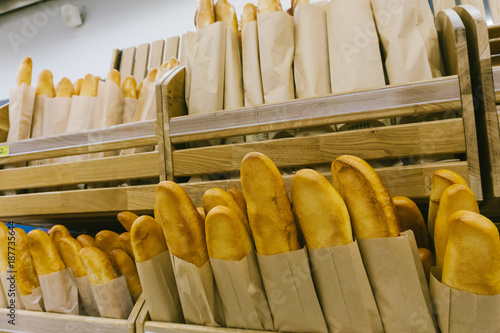 Focus on shelves with bread in a supermarket