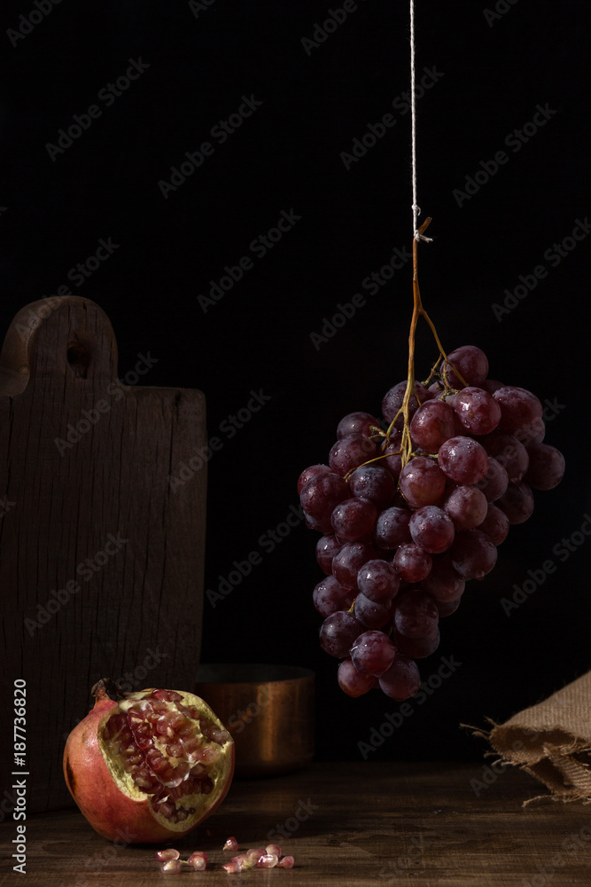 Pictorial fruits still life with grapes and pomegranate.