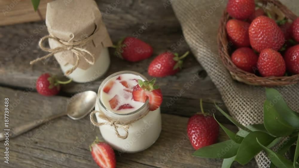 Organic yogurt with strawberries in a glass jar. Organic yogurt with strawberries in a glass jar.