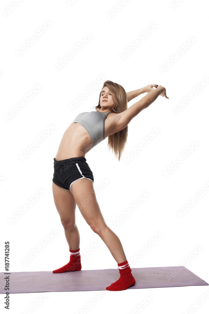 Fitness beautiful girl made stretch on white background isolated