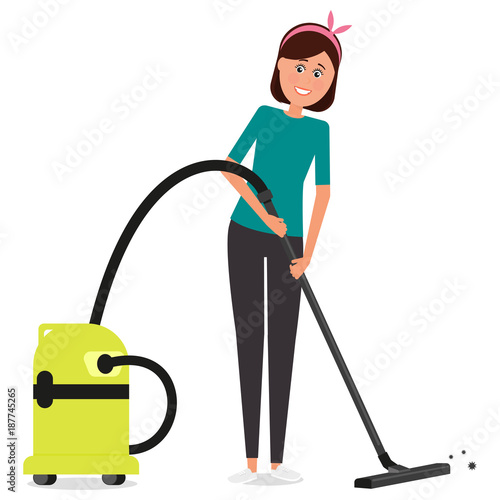 Young beautiful woman vacuuming the floor.