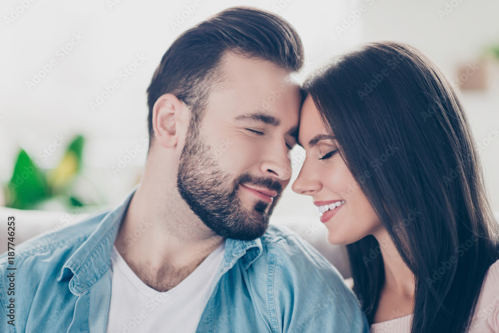 Fototapeta premium I will love you forever, you are the only one for me! Close up photo of two sensual sincere loving guy and woman wearing casual jeans denim clothes, they are touching their foreheads