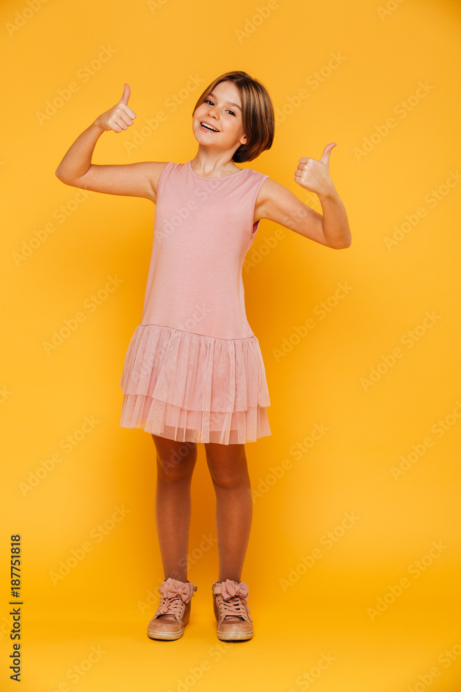 Portrait of happy carefree girl smiling and showing thumbs up isolated Portrait of happy carefree girl smiling and showing thumbs up isolated
