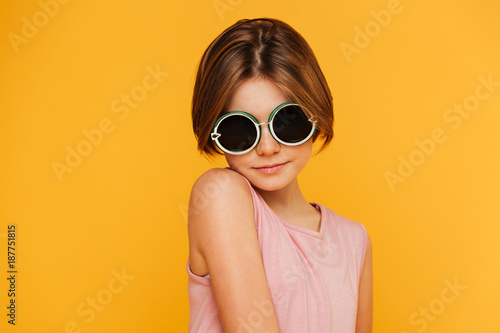 Portrait of serious girl in sunglasses looking camera © Drobot Dean