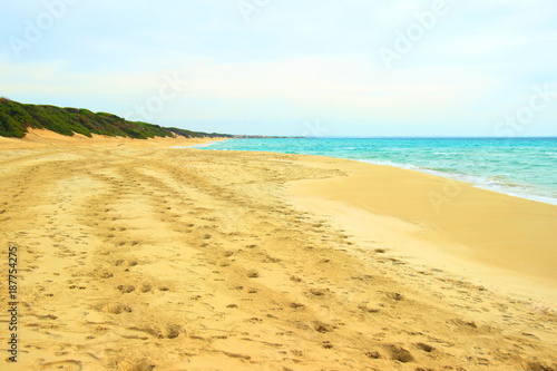 Footprints on beautiful sandy beach in Puglia  Italy