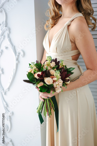 Woman in beautiful dress ho...