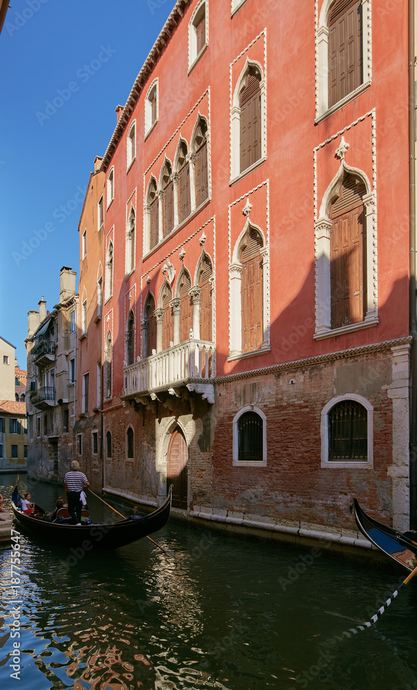 Venice, Italy - August 14, 2017: Venice canal with boats and classic buildings.