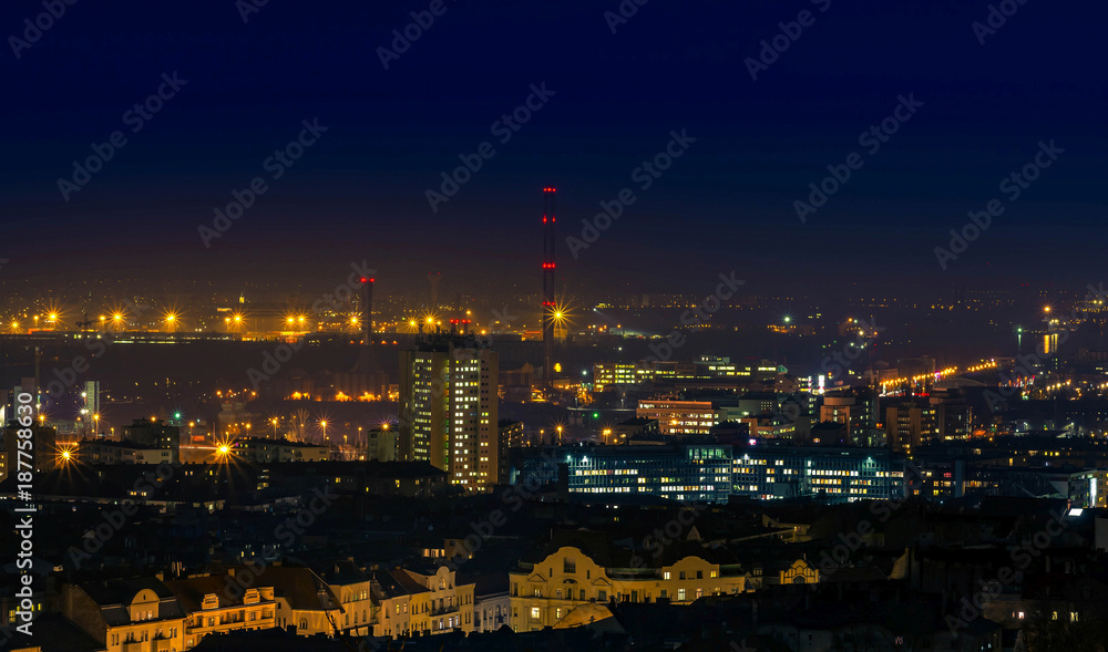 City at night with urban buildings