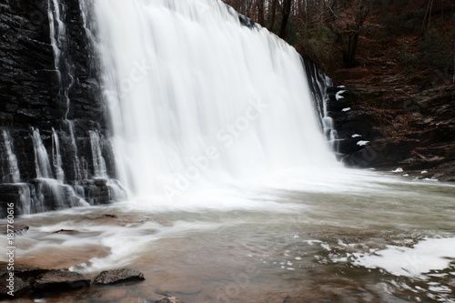 Water Cascading over and through a stone wall.