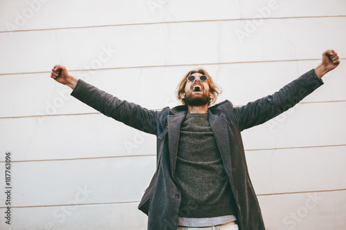 Portrait of a successful bearded man wearing sunglasses photo