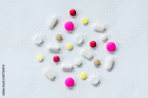 Top view of the pills on the white background, The drug and capsule pills on the floor, Pile of the drug and pills on the white background.