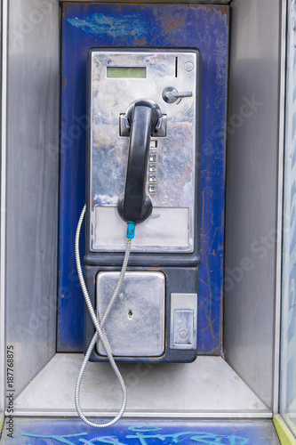 Public metal telephone of coins in Guatemala, Latin America.