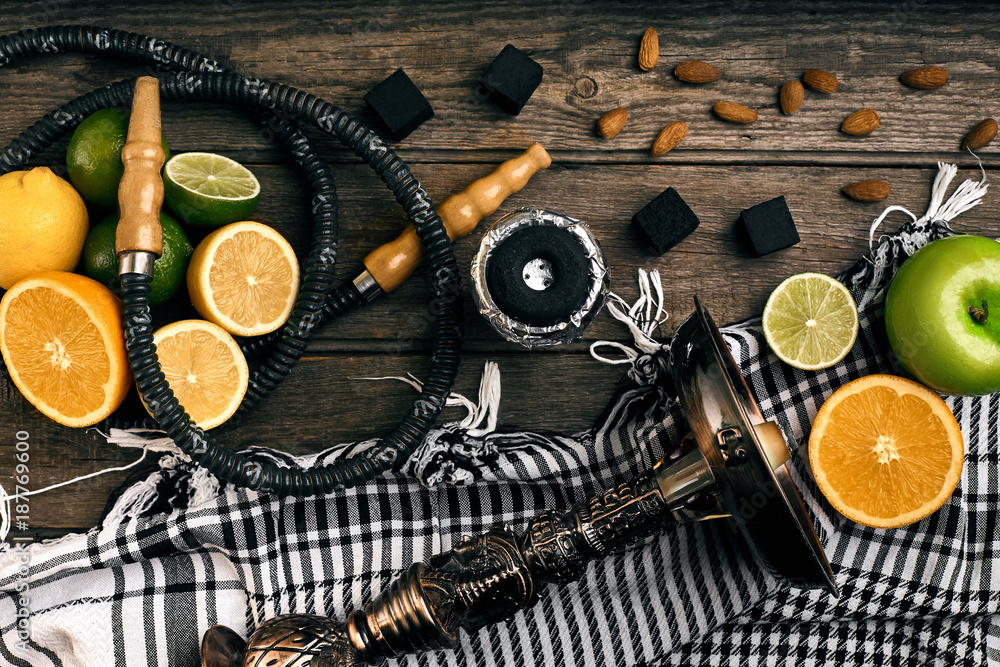 Stylish Smoking hookah and basket with lemon, lime and orange on