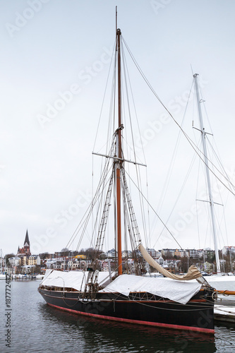 Sailing yachts moored in marina in winter