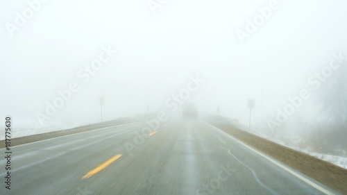 Traveling down the highway in the fog